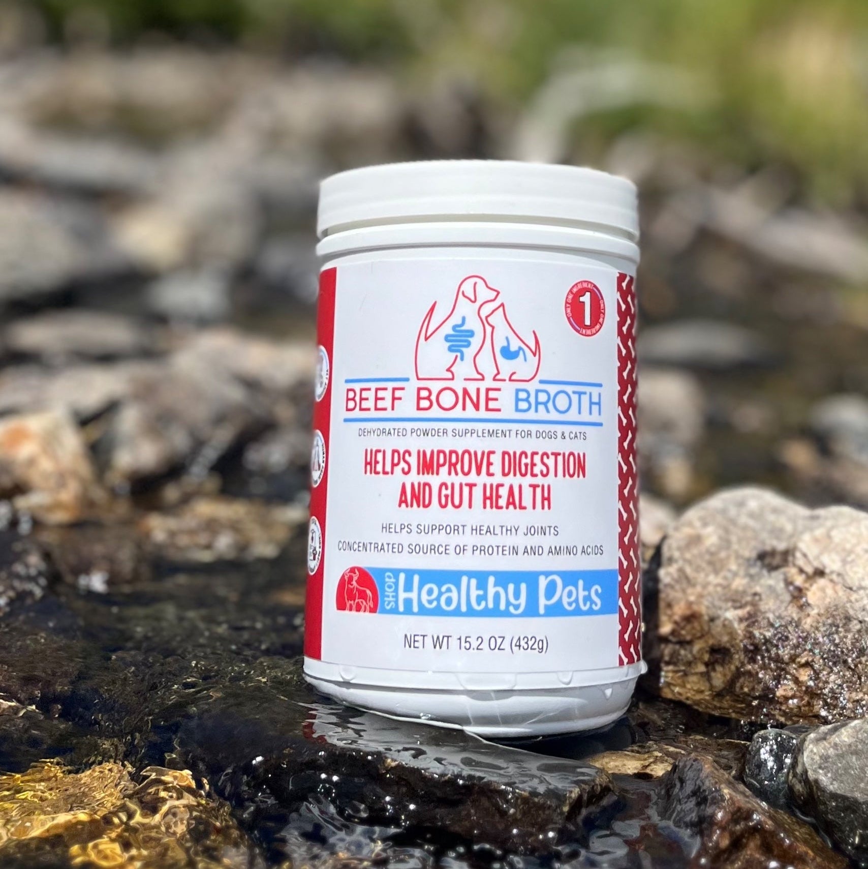 Container of Beef Bone Broth for pets on a natural background